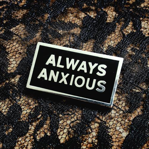 &quot;Always Anxious&quot; in silver block text on black enamel pin with gloss finish. Art by Print Ritual.